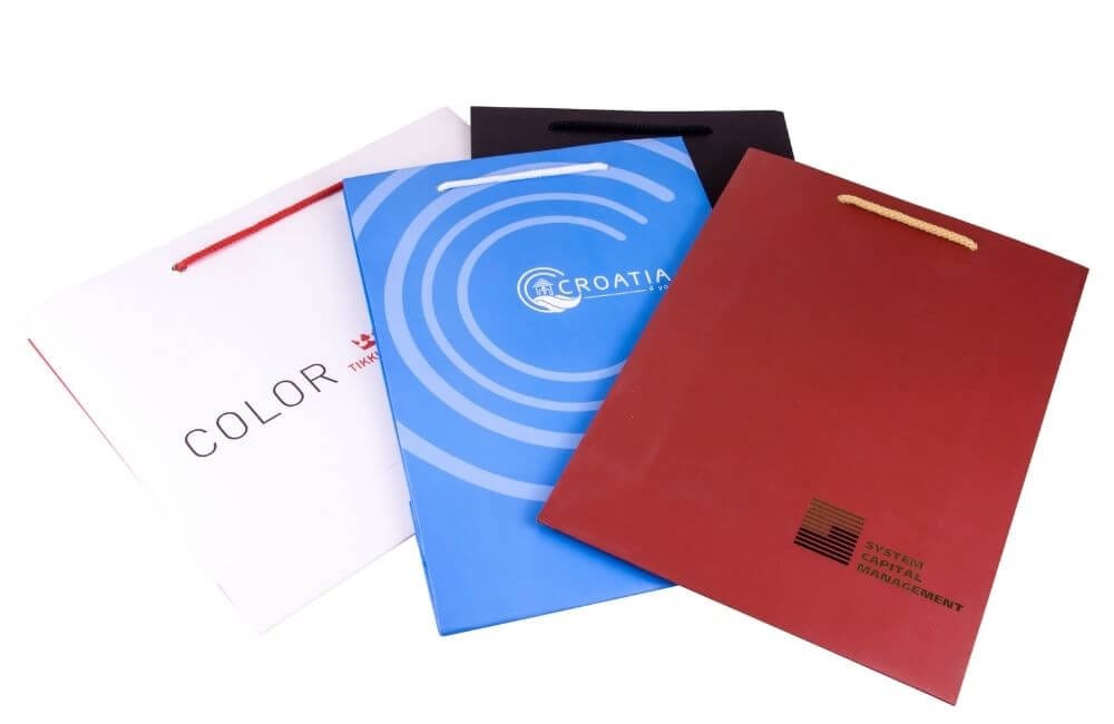 Виготовлені на замовлення паперові пакети із друком логотипу фото