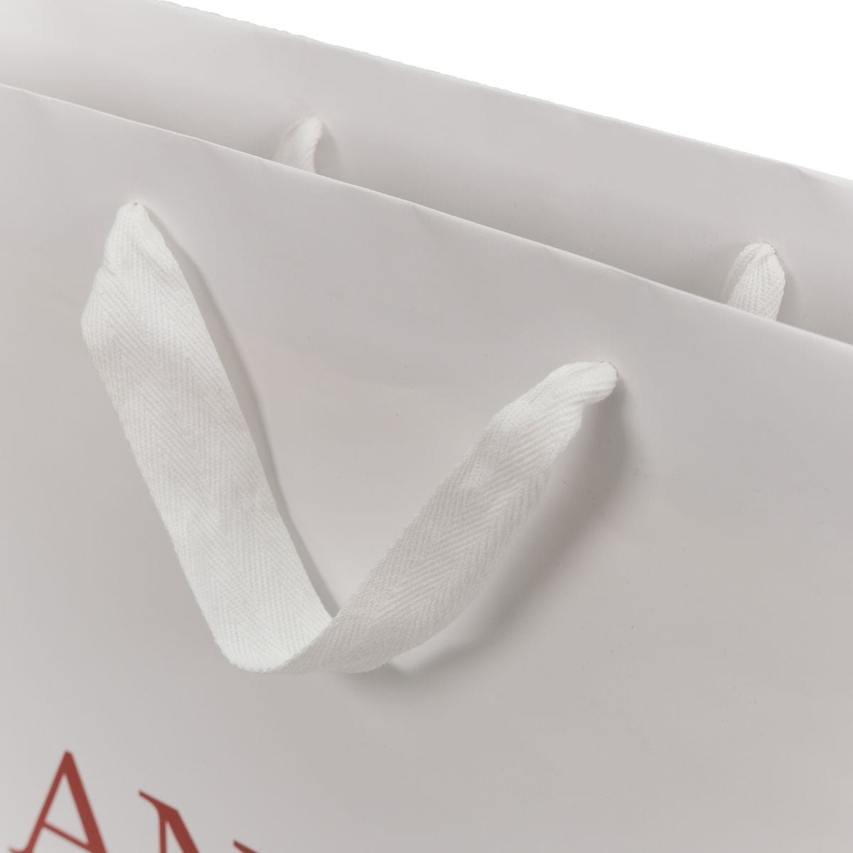 Ручки стрічка кіперна біла на пакеті приклад фото