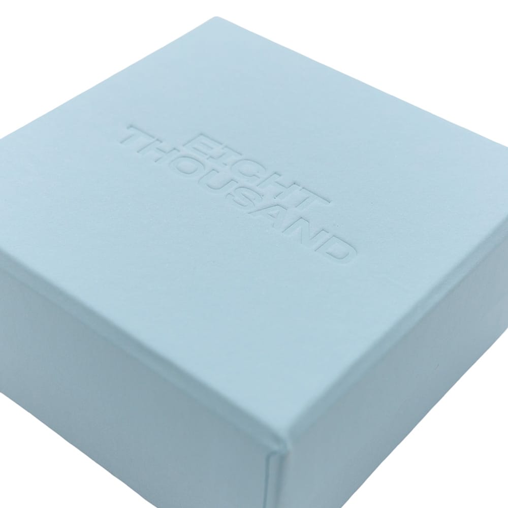 Сліпе тисненення на коробці фото